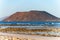 View Corralejo dunes, white sandy beach, blue water, Lobos and Lanzarote islands, Fuerteventura, Canary islands, Spain