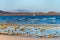 View Corralejo dunes, white sandy beach, blue water, Lobos and Lanzarote islands, Fuerteventura, Canary islands, Spain