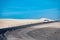 View Corralejo dunes, white sandy beach, blue water, Lobos and Lanzarote islands, Fuerteventura, Canary islands, Spain