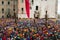 View of the Corsa dei Ceri or the candle race in the main square Piazza della Signoria of Gubbio with many tourists