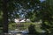 View of a cosy relaxation area under awnings with tables and chairs on the shores of Lake Ariana