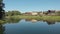 View of the country village. Flying drone above the pond