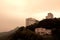 A View of couple isolated houses on the hill which have been shot from Victoria Peak in Hong Kong