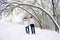 View of couple in love from the back in winter outdoors