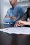 View of couple at table with divorce documents