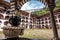 View of the courtyard from under the arches of the monastery