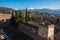 View of courtyard, walls and tower of Alcazaba, citadel of Alhambra, Nasrid with Sierra Nevada mountains in snow