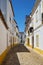 The view of cozy narrow street of Evora. Portugal