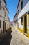 The view of cozy narrow street of Evora. Portugal