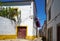 The view of cozy narrow street of Evora. Portugal