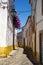 The view of cozy narrow street of Evora. Portugal