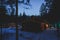 View of a cozy wooden scandinavian cabin cottage chalet house covered in snow near ski resort lodge in winter with the christmas