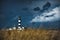 View of Creach Lighthouse in Ushant, France with a cloudy sky in the background