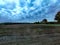 View of cropland with dramatic sky