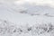 View of the Crown Range mountains after snowfall.