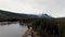 View from the crowns of trees towards the snowy mountain peak