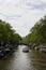 View of a cruise canal tour boat, trees