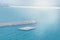 View from the cruise ship to the port with breakwaters, lighthouse and floating platform. Panorama of the port of Valencia, Spain