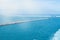 View from the cruise ship to the port with breakwaters, lighthouse and floating platform. Panorama of the port of Valencia, Spain