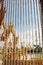 View through the crystal bead behind a curtain is buddha statue and blue sky