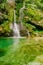 View of crystal clear water and small pond with waterfalls in the middle of the Triglav national park. Slap Virje, Virje waterfall