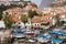 View of CÃ¢mara de Lobos in Madeira with Cape GirÃ£o on the background and boats at the marina, Portugal