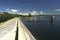 view of a dam that forms a reservoir in a mountainous context. Dinghies sailing on the lake. Embalse de Rio Tercero, CÃ³rdoba,