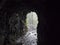 View from dark water duct tunnel through running water to lush jungle at hiking trail Los Tilos at mysterious laurel