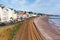 View of Dawlish Devon England with beach railway track and sea