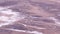 View of the Death Valley, California, with salt deposits sediments winding through the land.