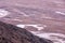 View of the Death Valley, California, with salt deposits sediments winding through the land.