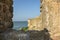 View of the defensive medieval fortress from the sea against the blue sky.