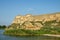 View of the defensive medieval fortress from the sea against the blue sky.