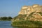 View of the defensive medieval fortress from the sea against the blue sky.