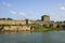 View of the defensive medieval fortress from the sea against the blue sky.