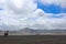 The view of the desert in Bromo, East Java in the morning was caught on camera when the wind was blowing hard.