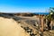 View of diagonal nordic dune rib and protective fences of wood, pine branches, hills and Baltic sea at Curonian spit