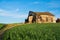 View of Dilapidated wood barn seen from the rural wheat fields