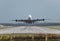 View directly down the runway as an Emirates Airline plane takes off from London Gatwick Airport heading for Dubai