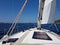 View into the distance from the cockpit of a yacht sailing past the green islands against a blue clear sky. Active rest and fascin