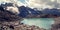 View of Distant Peaks. Bright blue water in the alpine lake.