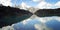 View of Distant Peaks. Calm alpine lake. Caucasus Mountains, Russia.