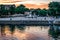 View from the Dnieper River to the Kherson embankment at twilight Ukraine. Many people-tourists walk along the promenade in the