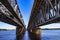 View of the Dnieper river under the Amur bridge in Dnipro Ukraine. Engineering-architecture geometric background with straight