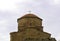 View of the dome of the ancient monastery Jvari against the sky