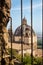 View of the dome of the Basilica of Santa Margherita through a window of the Fortress of popes Rocca dei Papi in MOntefiascone
