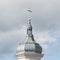 View of the dome of a modern Catholic church on a background of blue sky with clouds. Concept architecture, easter, religion