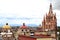 View of dome and towers of cathedral and town of San Miguel de Allende in Guanajuato Mexico