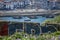 View at the Douro river with rabelo boats and Gaia city as background, blur urban graffiti artwork on first plan