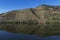 View of Douro River with terraced vineyards near the village of Pinhao, in Portugal